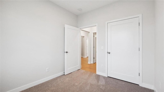 unfurnished bedroom featuring carpet flooring