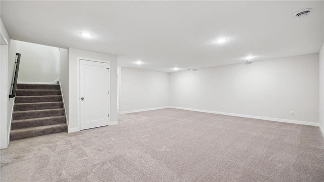 basement with light carpet