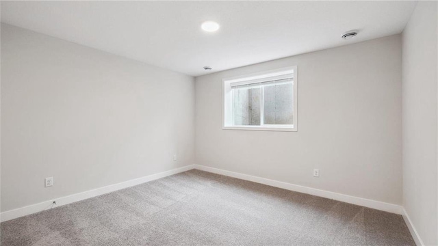 empty room featuring carpet flooring