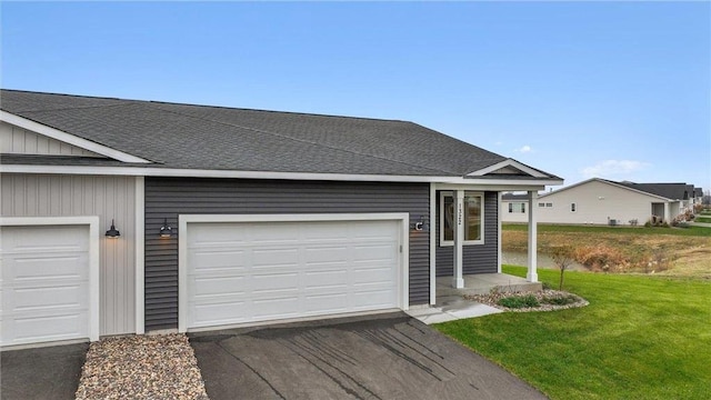 single story home featuring a front yard and a garage