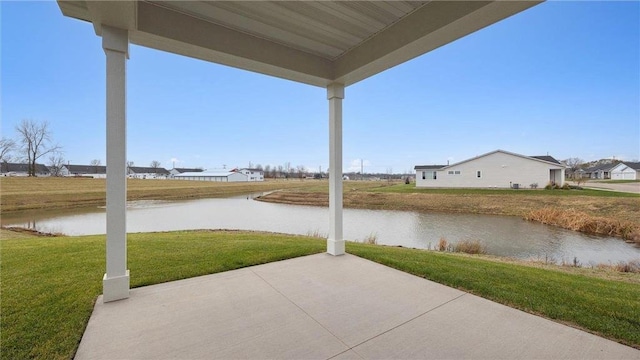 view of patio with a water view