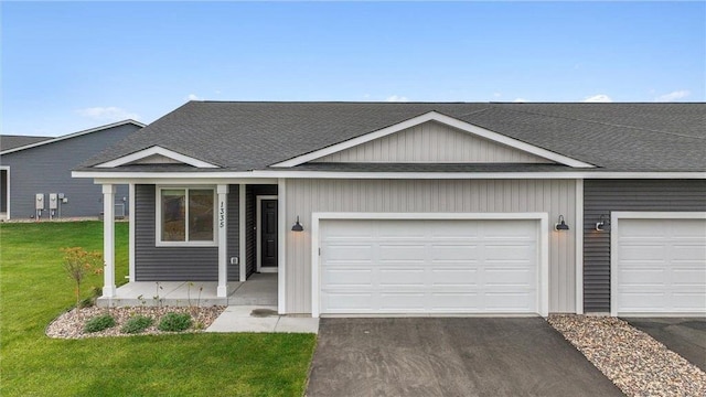 single story home with a front lawn and a garage