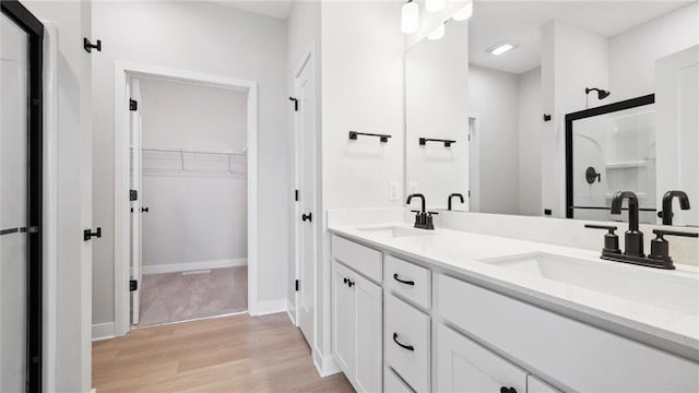 bathroom featuring vanity and wood-type flooring