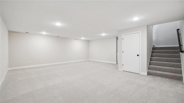 basement with light colored carpet