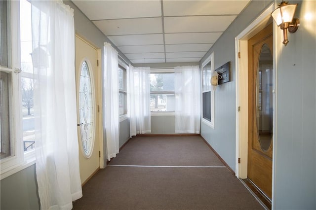 unfurnished sunroom with a paneled ceiling