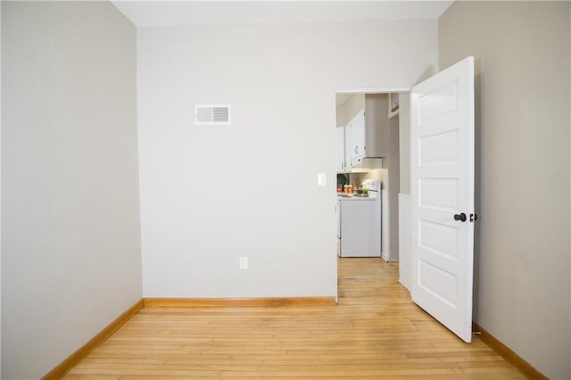 spare room featuring light hardwood / wood-style flooring