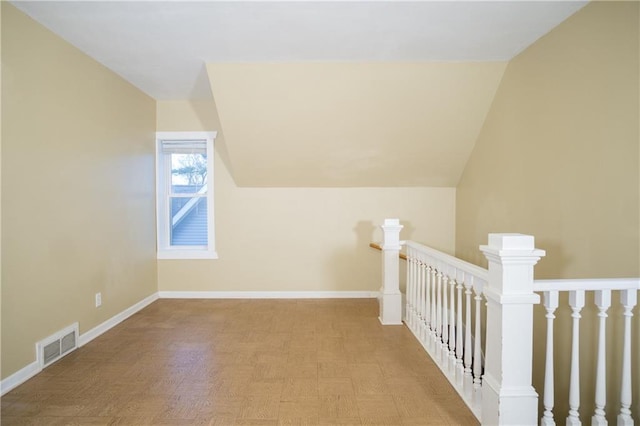 additional living space featuring vaulted ceiling