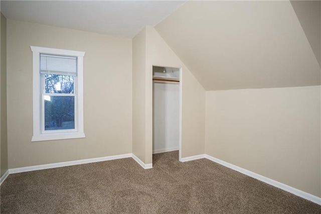 bonus room featuring carpet floors and vaulted ceiling