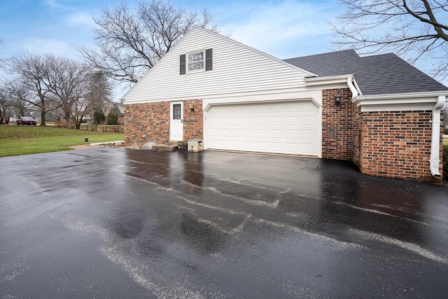 view of side of property featuring a garage