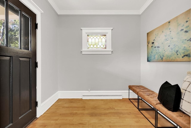 entrance foyer with crown molding and light hardwood / wood-style floors