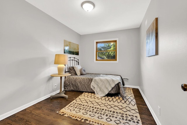 bedroom featuring dark wood-type flooring