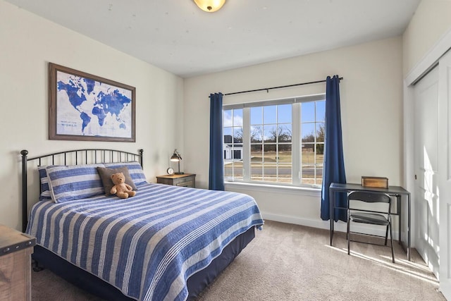 carpeted bedroom with a closet