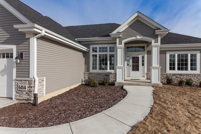 doorway to property featuring a garage