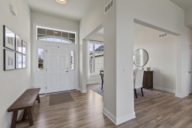 foyer featuring a high ceiling and hardwood / wood-style flooring