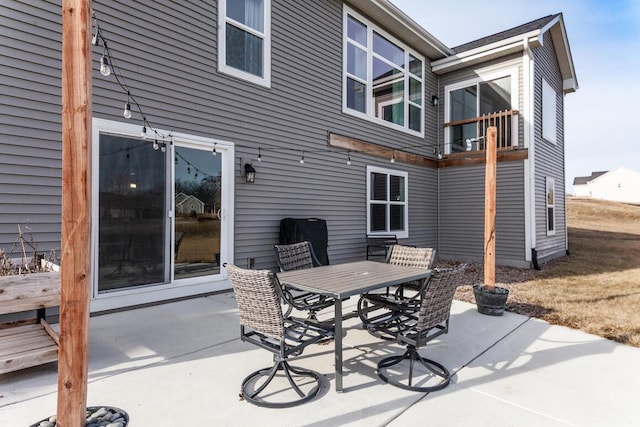 view of patio featuring a balcony