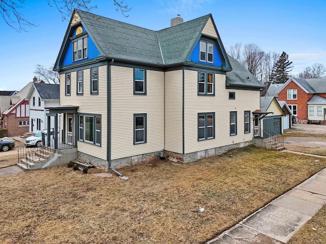 view of home's exterior featuring a yard