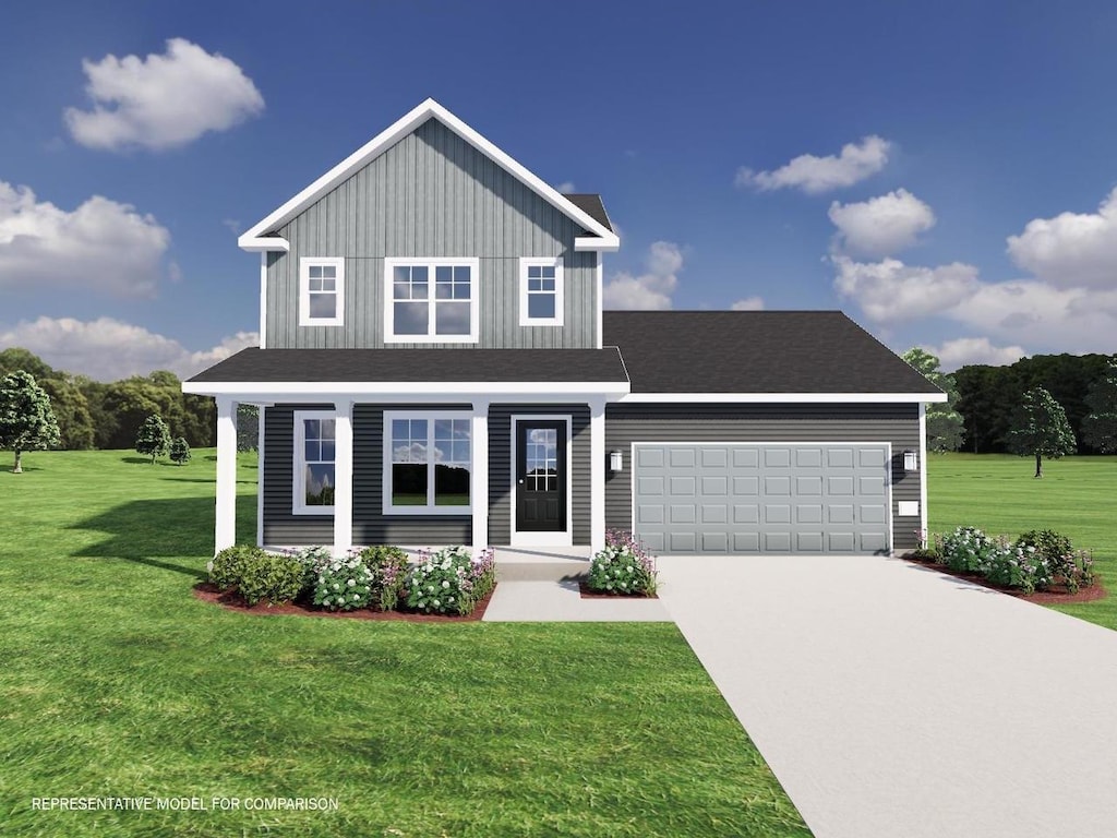 view of front facade with a garage and a front lawn