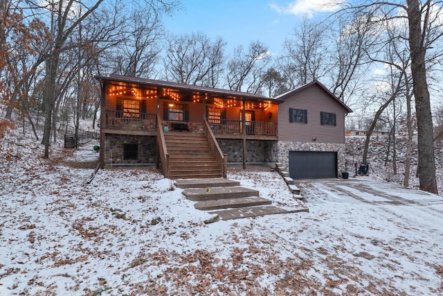 view of front of home with a porch and a garage