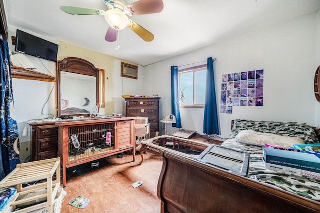 bedroom featuring ceiling fan and an AC wall unit