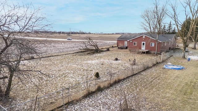 view of yard with a rural view