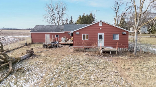 back of property featuring a deck