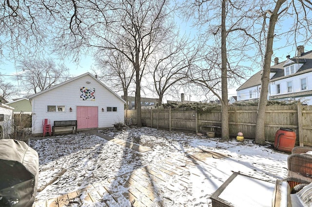 snow covered deck with an outbuilding