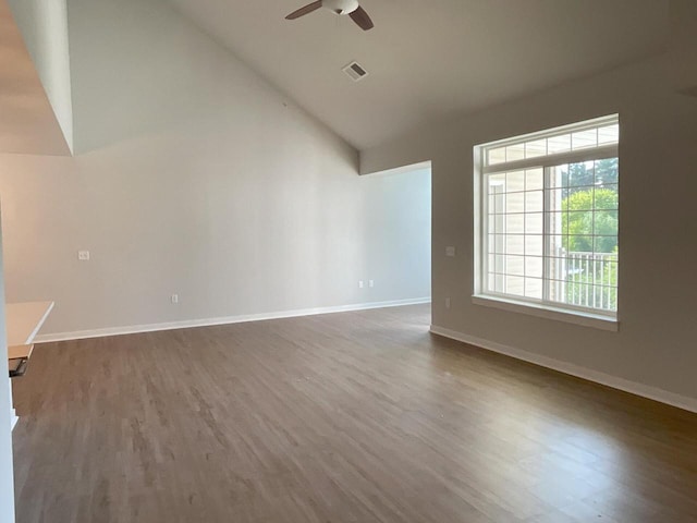 unfurnished living room featuring lofted ceiling, ceiling fan, and wood-type flooring