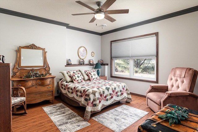 bedroom featuring a textured ceiling, light hardwood / wood-style flooring, ceiling fan, and ornamental molding