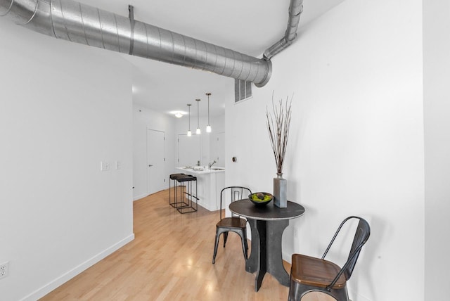 dining area with light hardwood / wood-style flooring