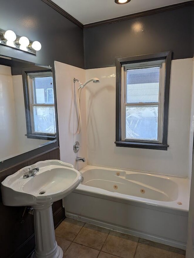 bathroom with ornamental molding, tile patterned floors, shower / washtub combination, and a healthy amount of sunlight