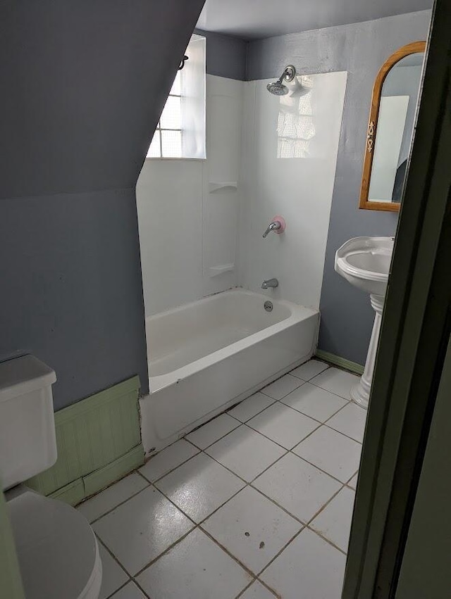 full bathroom with sink, tile patterned flooring, toilet, and tub / shower combination