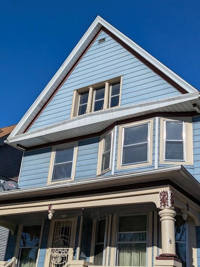 view of property exterior featuring a porch