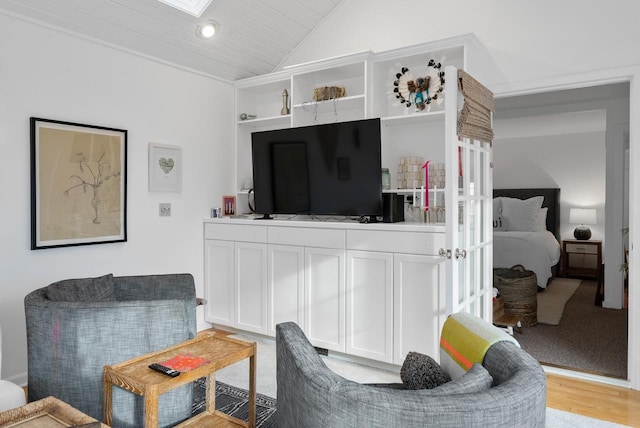 living room featuring light wood-type flooring, vaulted ceiling, and wood ceiling