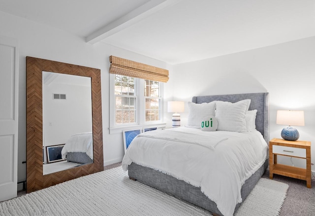 bedroom featuring beamed ceiling