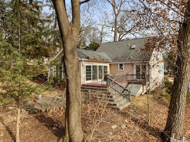 back of house featuring a deck