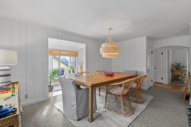 dining space with an inviting chandelier