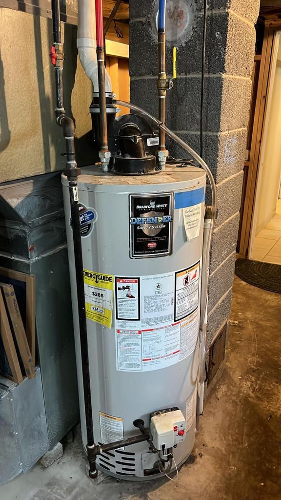 utility room featuring gas water heater