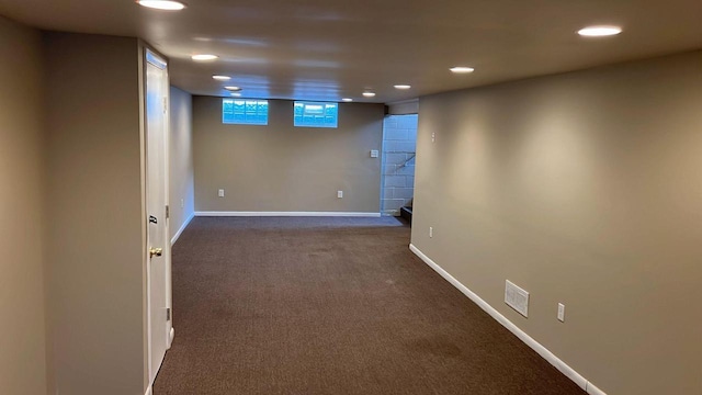 basement with dark carpet