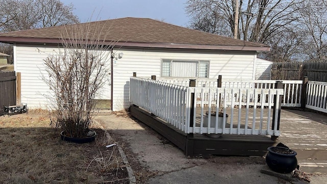 rear view of house featuring a deck