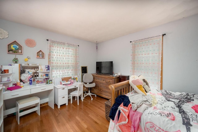 bedroom with light wood-type flooring