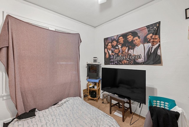 carpeted bedroom with ceiling fan and crown molding