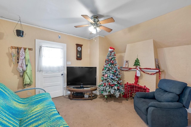 carpeted living room with ceiling fan