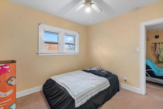 bedroom featuring ceiling fan and light colored carpet