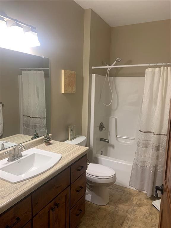 full bathroom featuring shower / bath combination with curtain, vanity, and toilet