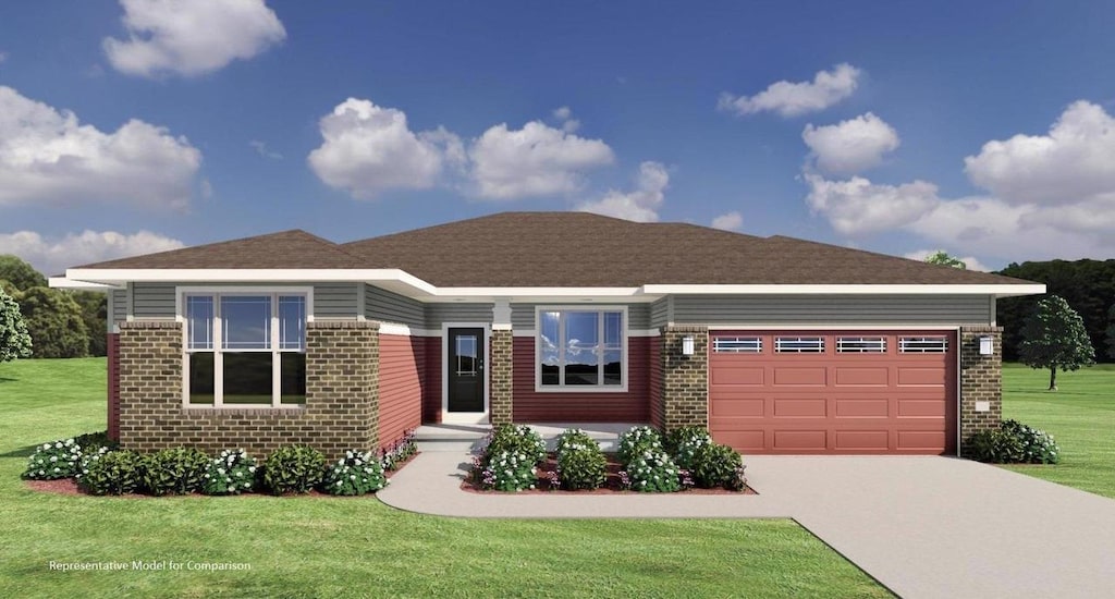 view of front of property featuring a garage and a front lawn