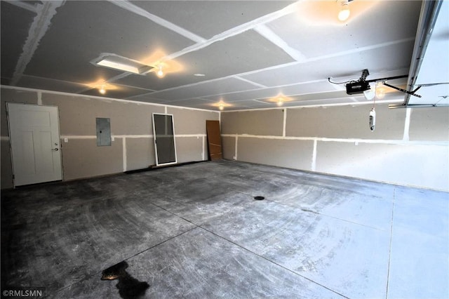 101 Nelson St, Elmwood, WI 54740 - garage featuring a garage door opener and electric panel