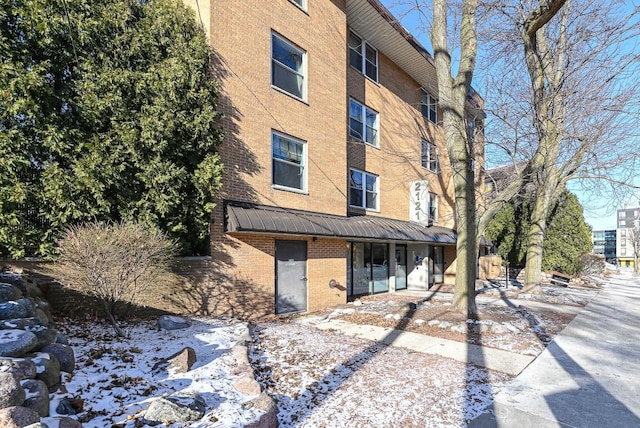 exterior space with brick siding