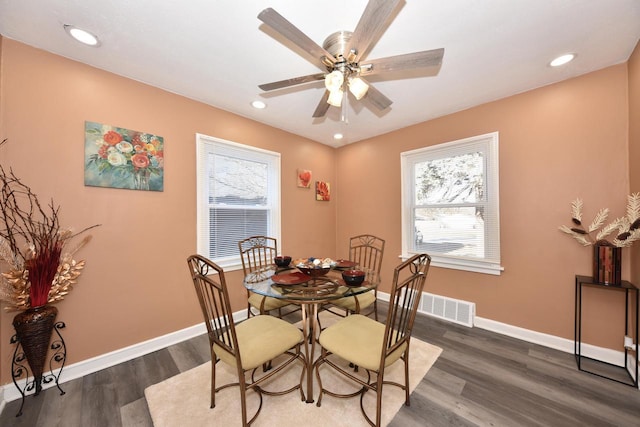 dining area featuring ceiling fan and dark wood-type flooring