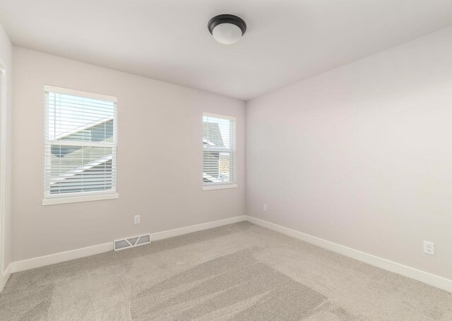 3620 Angelus Way, Cross Plains, WI 53528 - spare room with light colored carpet, visible vents, and baseboards