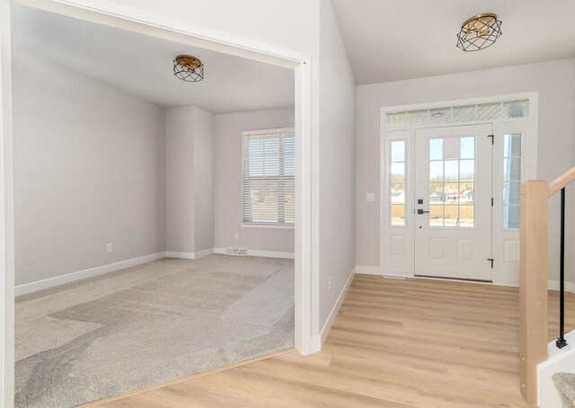 3620 Angelus Way, Cross Plains, WI 53528 - entryway with wood finished floors, baseboards, stairs, and visible vents